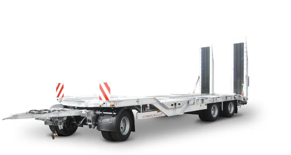 Schwarzmüller 3-axle low loader trailer with wheel recesses for transporting construction machinery
